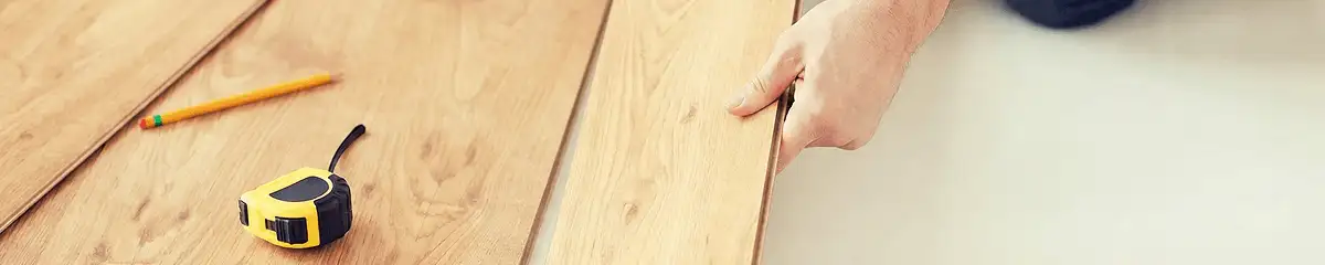 A professional installing wood flooring in Lakeland, FL