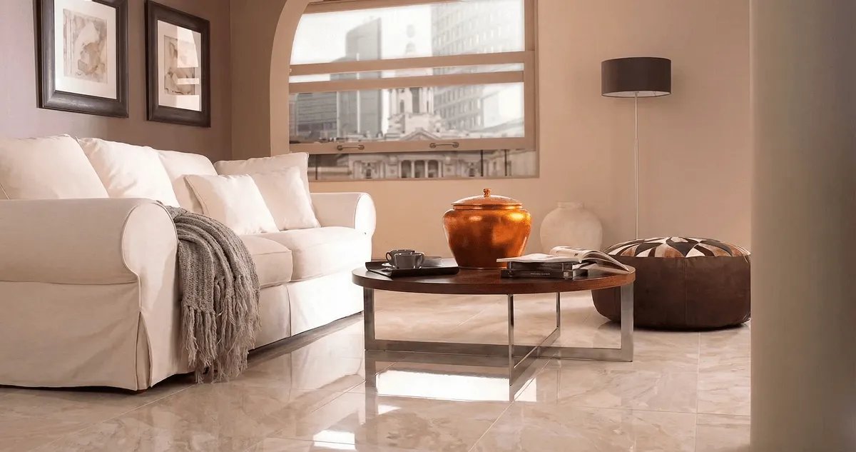 Modern living room with professionally installed marble flooring, a beige sofa, coffee table in Lakeland, FL