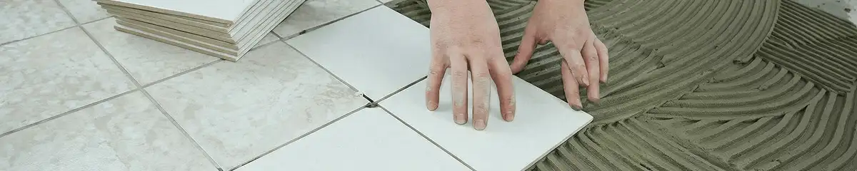 Professional installing white tile floors in Lakeland, FL