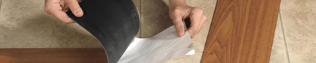 A professional installing vinyl flooring in Lakeland, FL