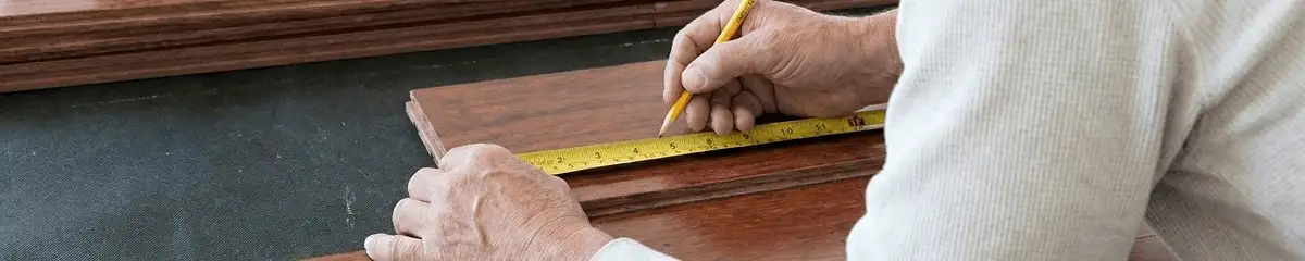 A professional installing wood flooring in Lakeland, FL